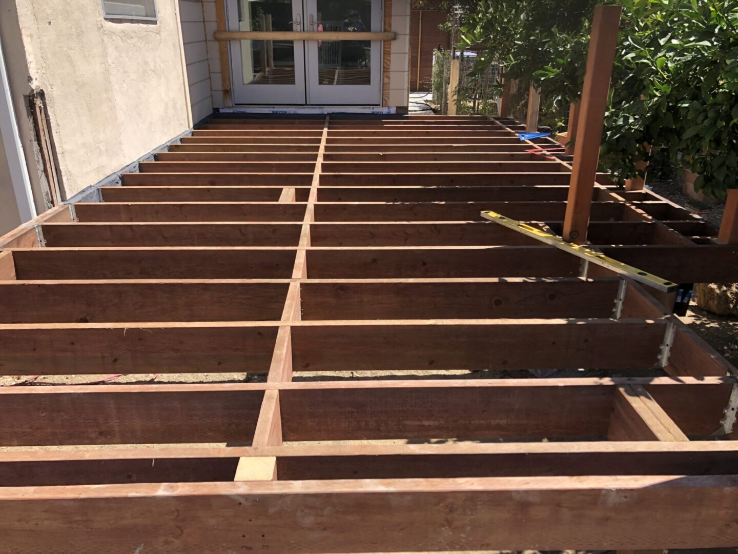 A deck that has been built with wood.