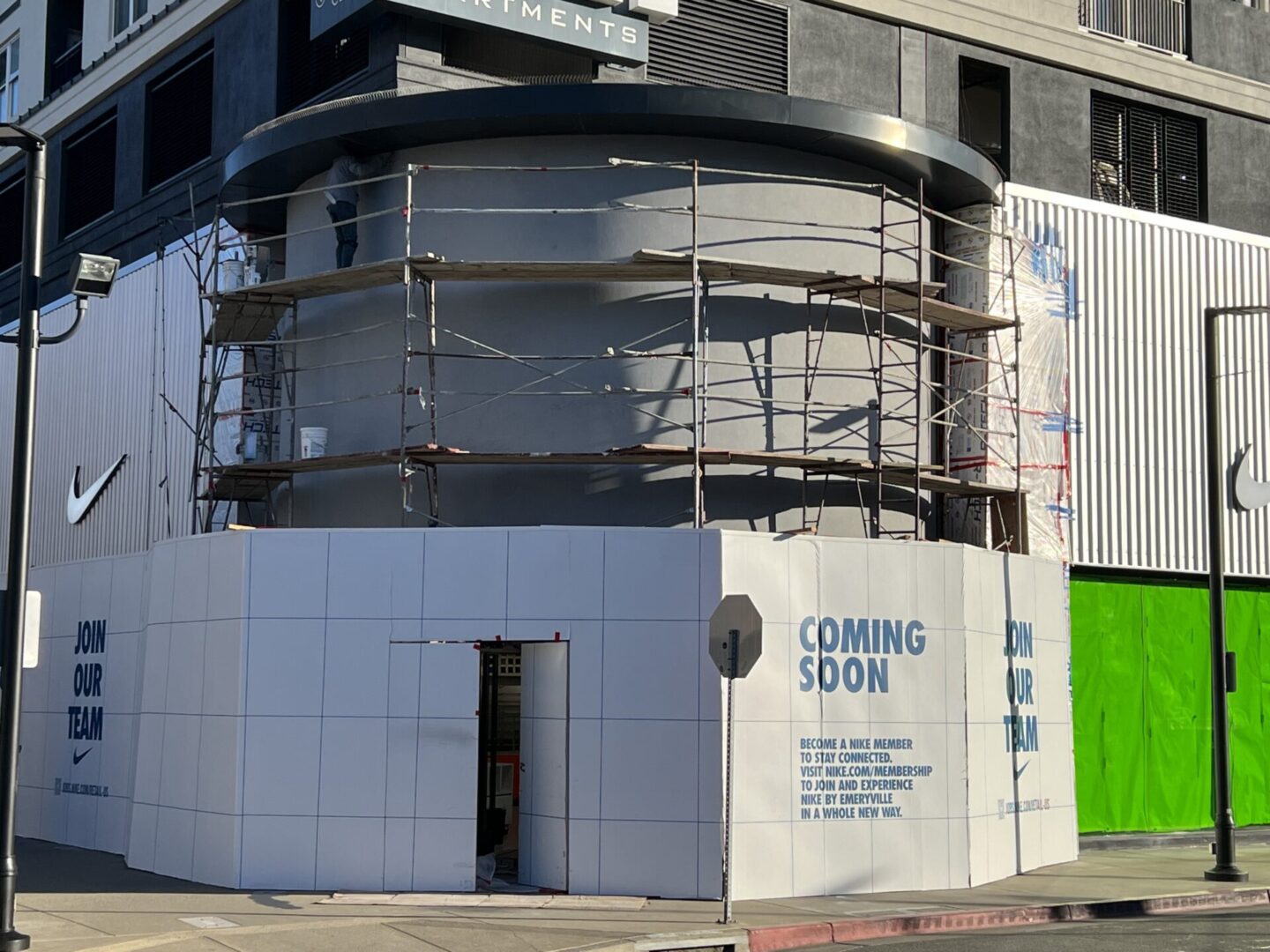 A building with scaffolding around it and the words " coming soon ".